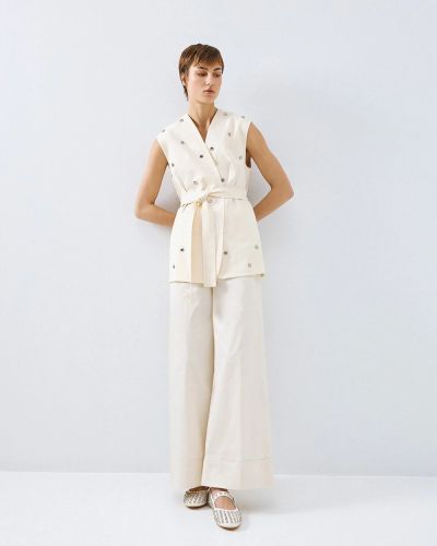 Oversized vest with eyelets - a modern and stylish choice ACCESS FASHION (SKU) 1015