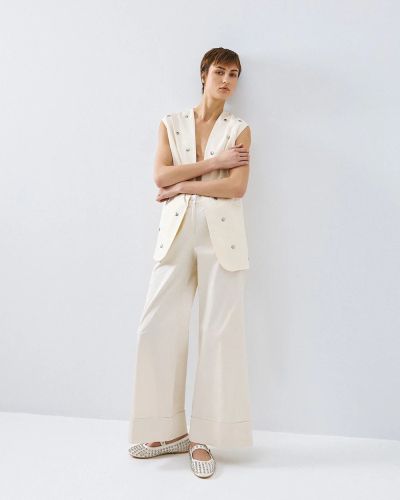 Oversized vest with eyelets - a modern and stylish choice ACCESS FASHION (SKU) 1015