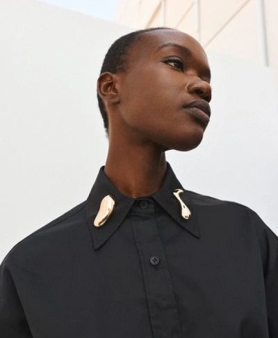 Elegant women's shirt, black, with attractive metal brooches for a stylish modern look! ACCESS FASHION (SKU)64-7021